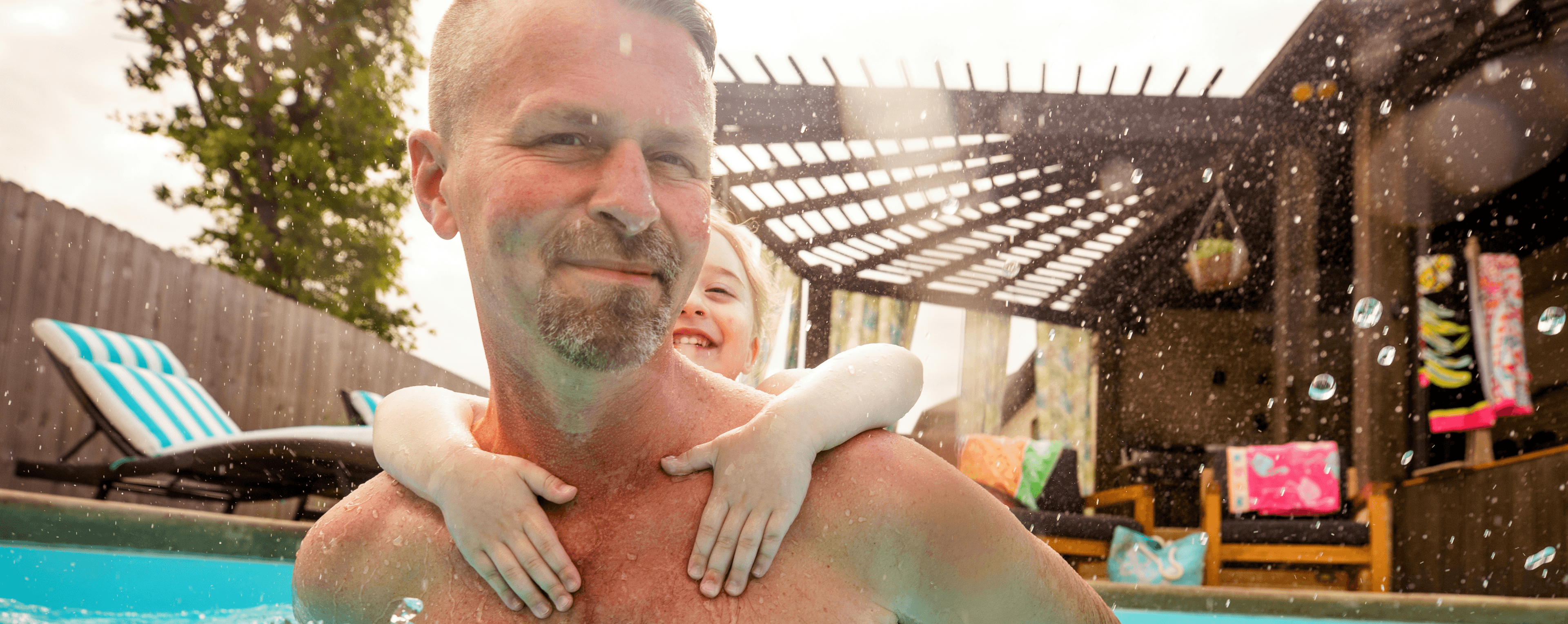 father and son in pool