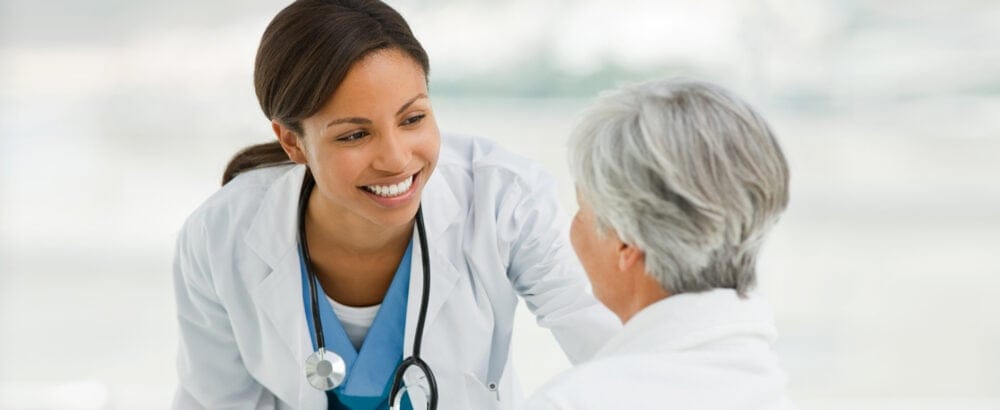 Doctor smiling at patient