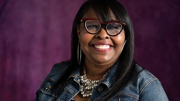 Woman in glasses smiling